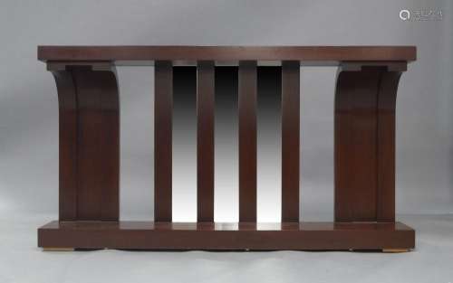 A modern mahogany console table, the plank top above two cur...