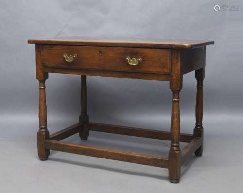 A George III oak side table, with single drawer, raised on f...
