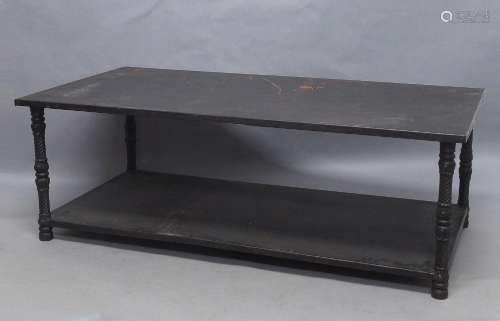 A Gothic style two tier coffee table, 20th century, with she...