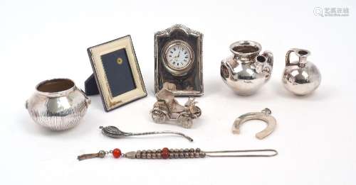 A group of silver and metal oddments, comprising: a silver e...