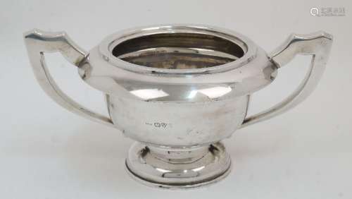 A filled silver twin handled trophy cup, Chester, 1911, E J ...