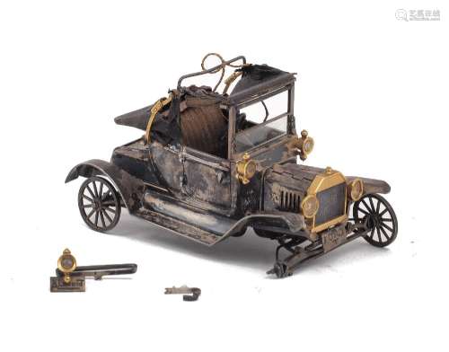 A white metal model of the Ford Model T car produced for the...