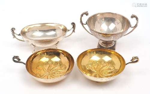 Two Continental gilt drinking cups with zoomorphic handles, ...