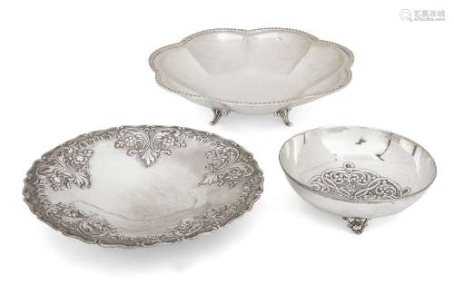 Three white metal dishes comprising: one Greek flowerhead de...