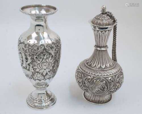 A Middle Eastern white metal vase, with embossed decoration ...