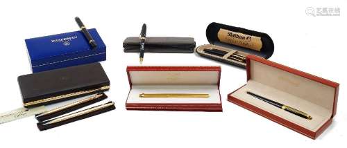 A collection of pens, to include: a les must de Cartier 18kt...