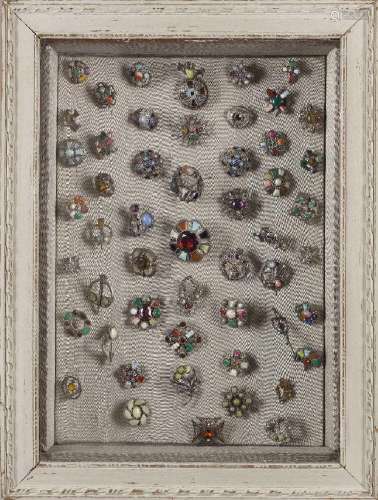 A framed Scottish plaid brooch collection, early to late 20t...