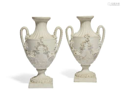 A pair of Derby white biscuit porcelain two-handled vases, c...