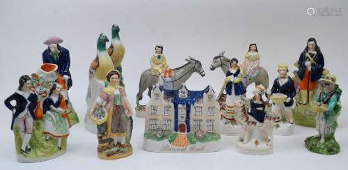 A collection of Staffordshire flatback figures and figure gr...