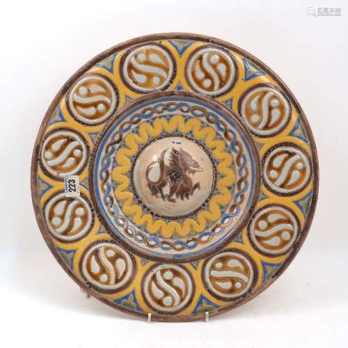A Continental pottery charger, late 19th century, of Hispano...