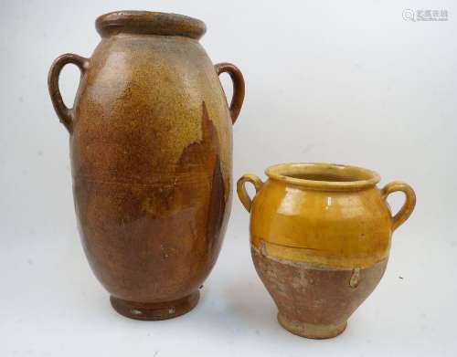 A large continental terracotta glazed twin handled jar, late...