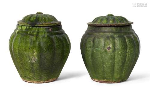 A pair of Chinese pottery green-glazed jars and covers, Ming...