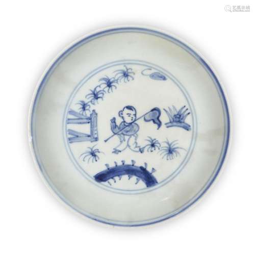 A Chinese porcelain blue and white `boy` dish, 18th century,...
