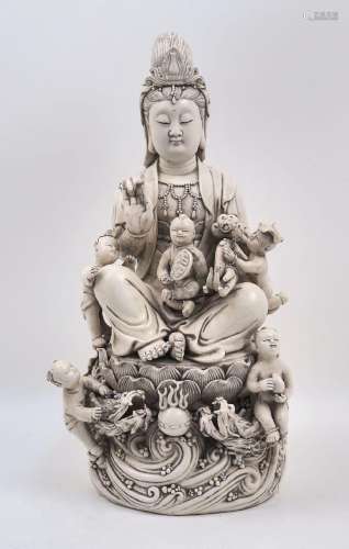 A Chinese white glazed porcelain figure group of Guanyin, 20...