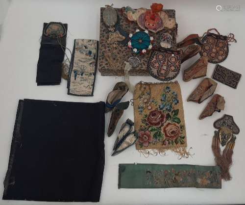 A collection of Chinese silk objects to include various embr...