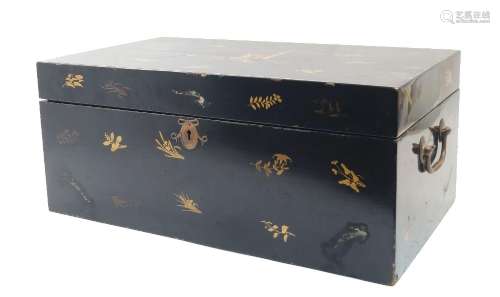 A Japanese black lacquer chest, gilt decorated to the exteri...