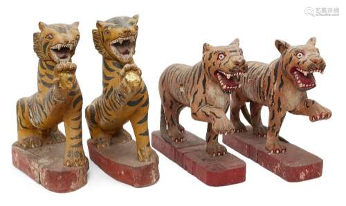 Four Burmese painted wood tigers, Tai Yai (Shan States), ear...
