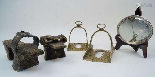 A pair of Middle Eastern brass stirrups, with pierced scroll...