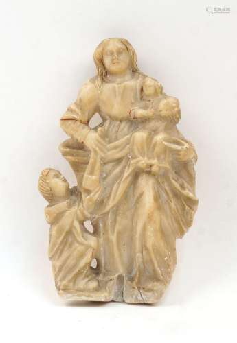 A fragmentary alabaster relief of the Madonna and Child, pos...