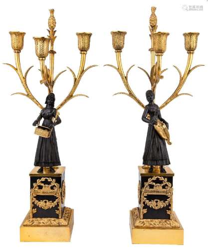 A pair of Louis-Philippe gilt and patinated bronze three-lig...