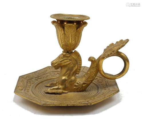 A gilt-bronze chamberstick, 19th century, the engine turned ...
