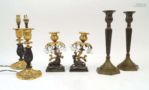 A pair of gilt and patinated bronze candlesticks, late 19th/...