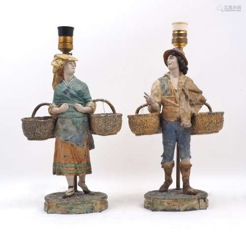 A pair of French cold painted figural lamps, early 20th cent...
