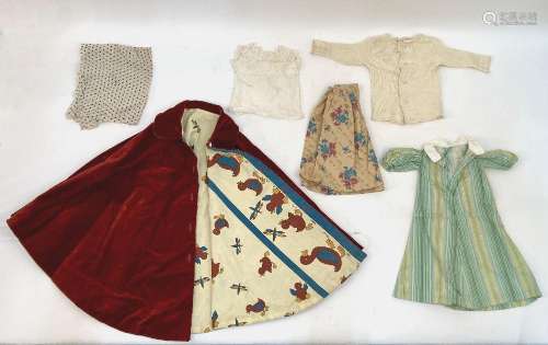 A selection of dolls clothes, together with lace, trimmings ...