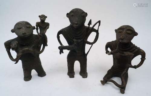 A group of three West African stylised cast brass figures, 2...