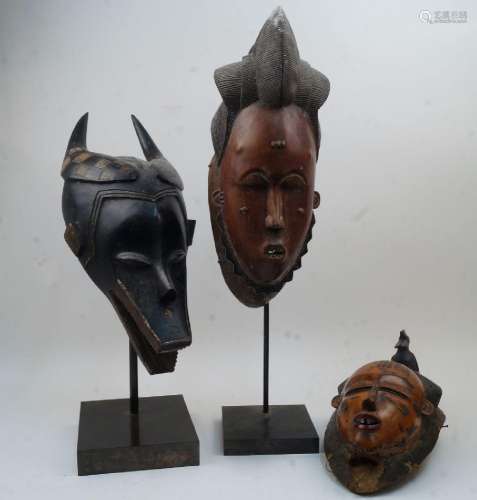 Three African masks, including: a Guro Zamble style mask, Co...