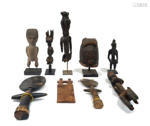 A quantity of African carved wooden figures and objects, to ...