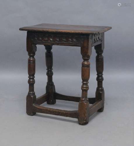 An oak joint stool, 17th century and later, the plank top wi...