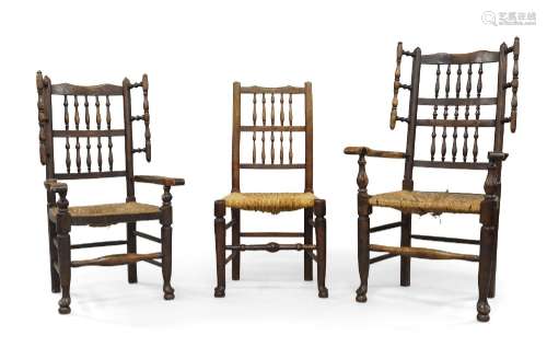A near pair of oak wing back armchairs, 18th century, with t...