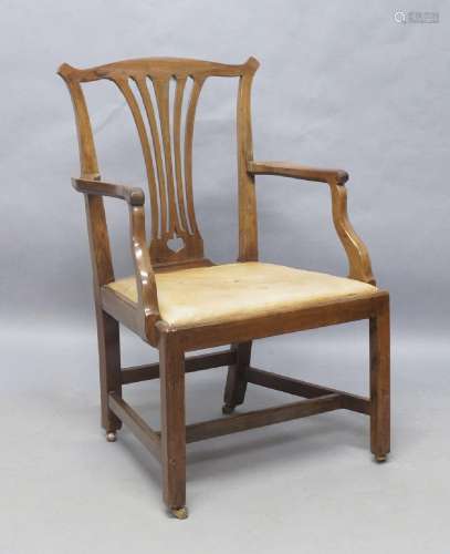 A George III walnut armchair, leather drop in seat, raised o...