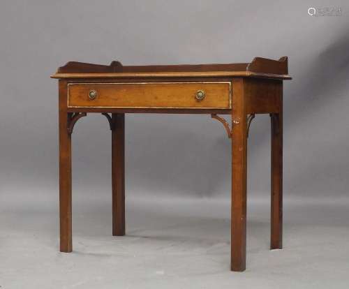 A George III mahogany side table, with gallery top, single d...