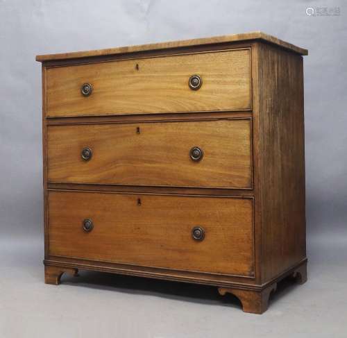 A George III mahogany chest, with three graduated drawers, r...