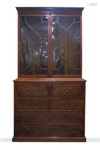 A George III mahogany secretaire bookcase, the moulded corni...