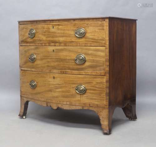 A Regency mahogany bow front chest of three drawers, raised ...