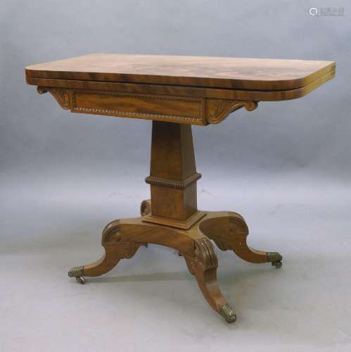 A Regency mahogany fold over tea table, the rectangular top ...
