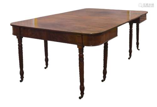 A Regency mahogany dining table, the two pedestal bases rais...