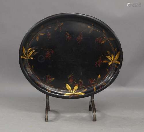A Victorian paper mache oval tray on ebonised stand, hand pa...