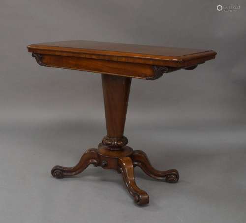 A Victorian mahogany card table, the hinged top above plain ...