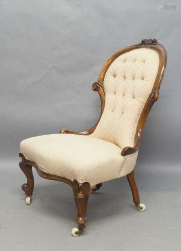 A Victorian mahogany nursing chair, with button back upholst...