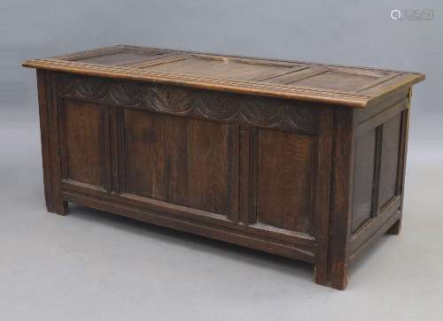 A 19th century and later oak coffer, the panelled hinged top...