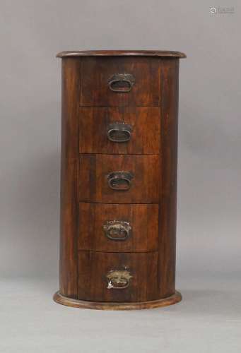 A modern teak pedestal chest, of cylindrical form, with five...