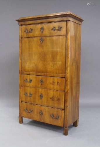 A Biedermeier walnut secretaire, 19th century, the top drawe...