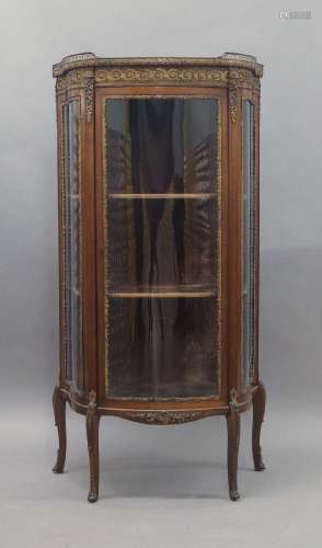 A French mahogany bow front vitrine, early 20th century, the...