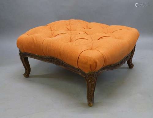 A large French walnut stool, early 20th century, orange butt...