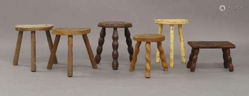 A set of six small rustic stools, 20th Century, largest 33cm...