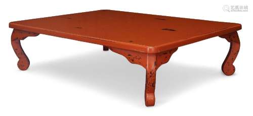 A Chinese red lacquered low coffee table, late 20th Century,...